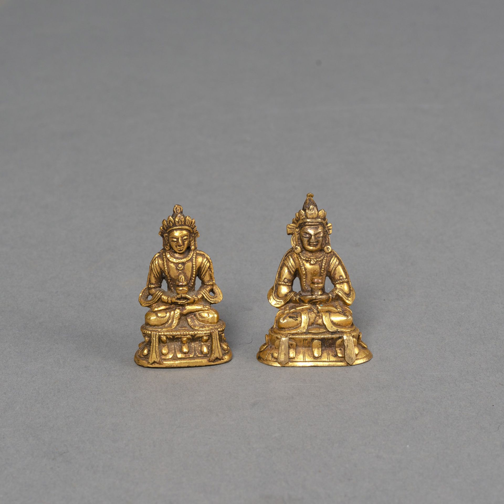 TWO MINIATURE GILT-BRONZE FIGURES OF AMITAYUS