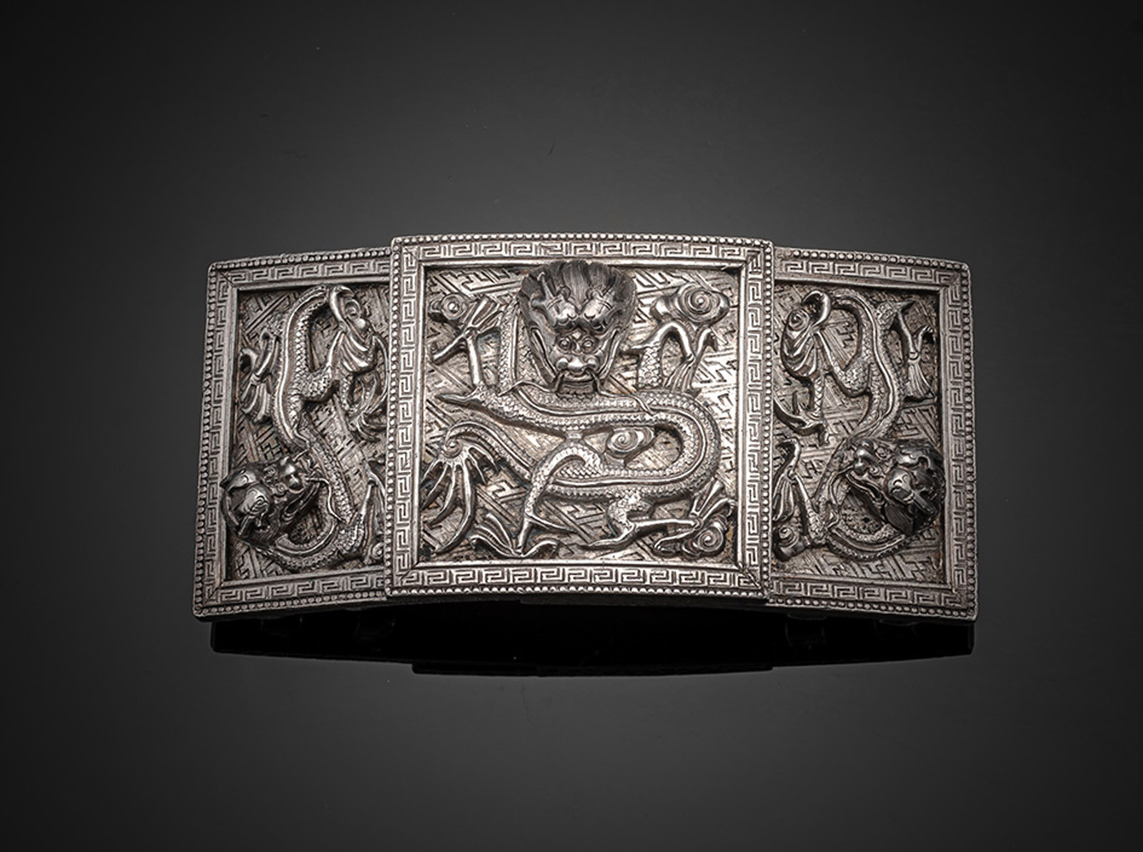 A TWO-PART SILVER DRAGON BELT BUCKLE