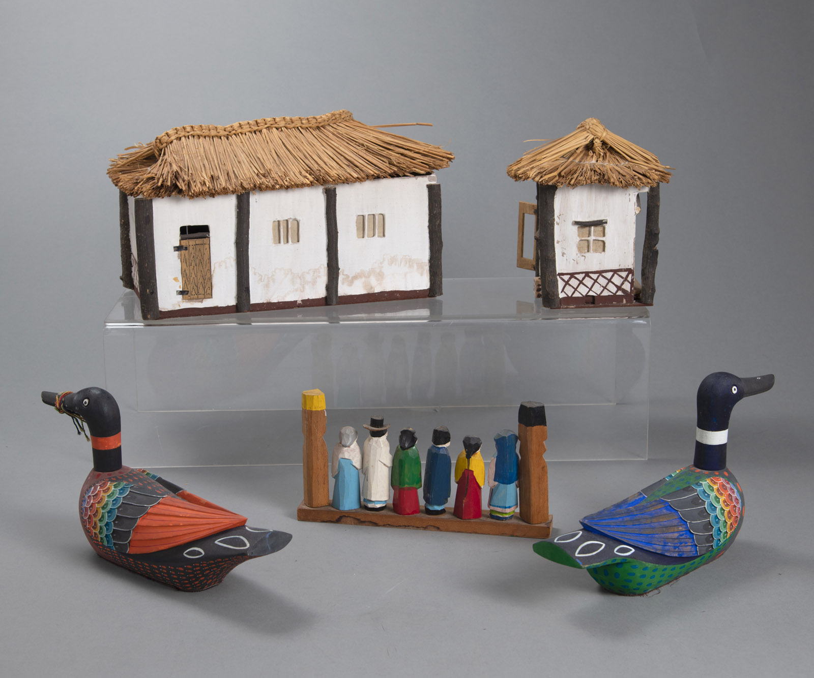 A MODEL OF A YANGBAN HOUSE MADE OF DIFFERENT MATERIALS, A GROUP OF PAINTED WOODEN FIGURES AND A PAI - Image 2 of 3