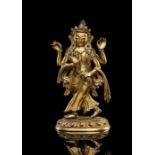 Seltene feuervergoldete Bronze einer vierarmigen Opfergöttin