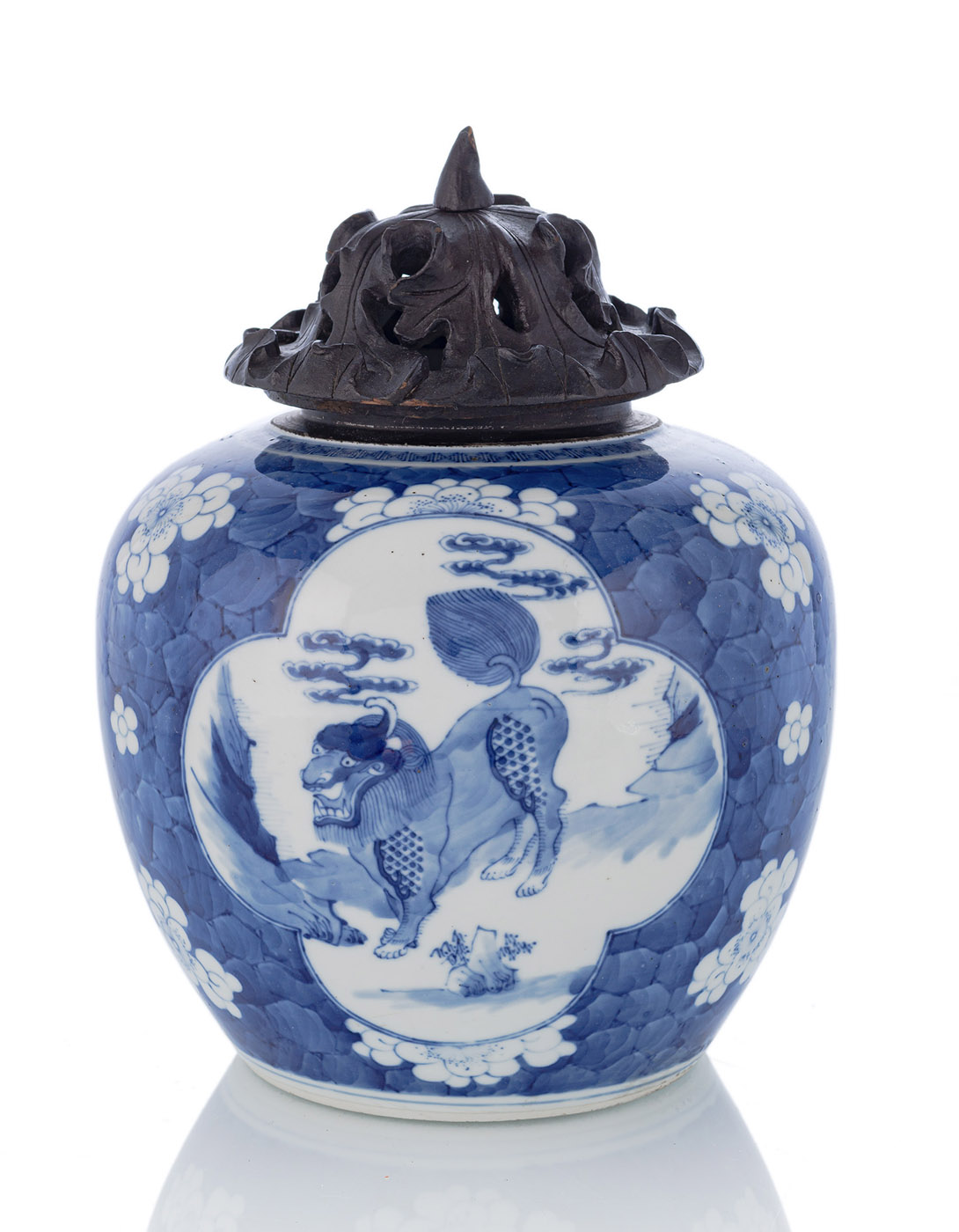 AN UNTERGLAZE BLUE PORCELAIN JAR WITH QILIN IN RESERVES ON A PLUM BLOSSOM BACKGROUND