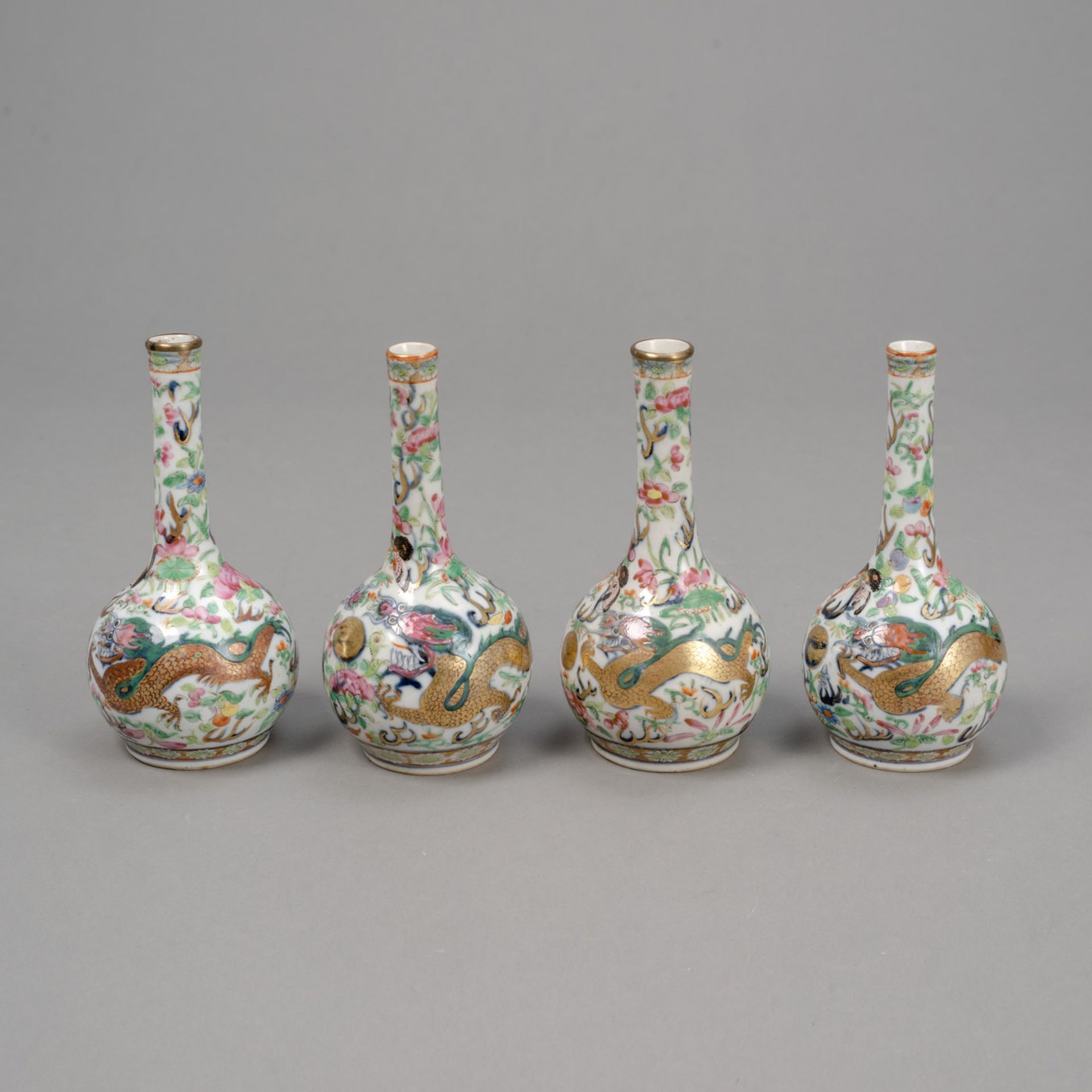 FOUR SMALL 'FAMILLE ROSE' DRAGON PORCELAIN VASES