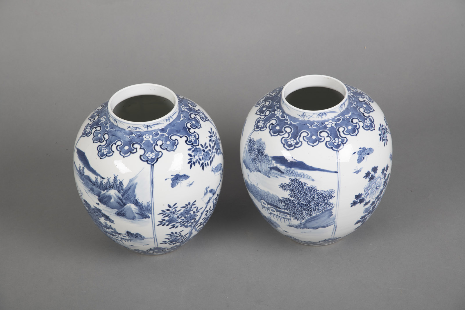 A PAIR OF BLUE AND WHITE LANDSCAPE AND FLORAL PORCELAIN VASES - Image 3 of 4