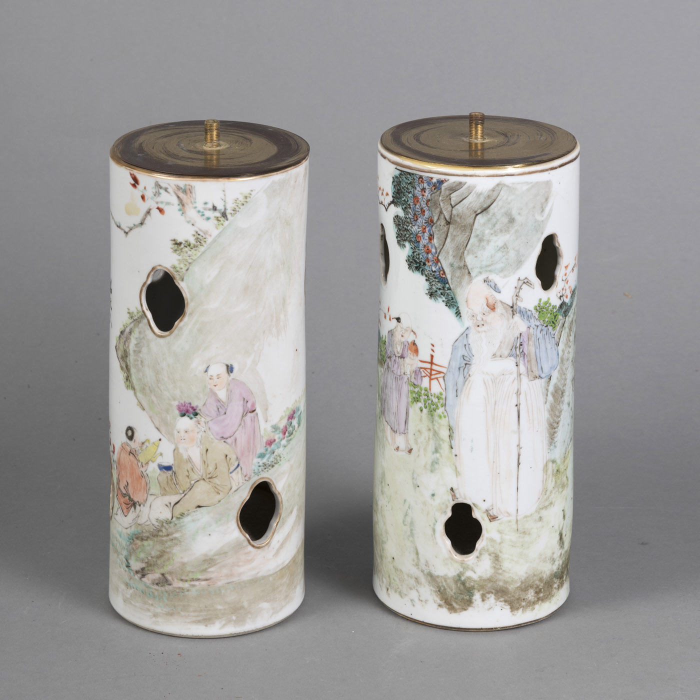 TWO CYLINDRICAL PORCELAIN HAT STANDS WITH FOUR-PASS OPENINGS AND 'FAMILLE ROSE' FIGURE DECORATION