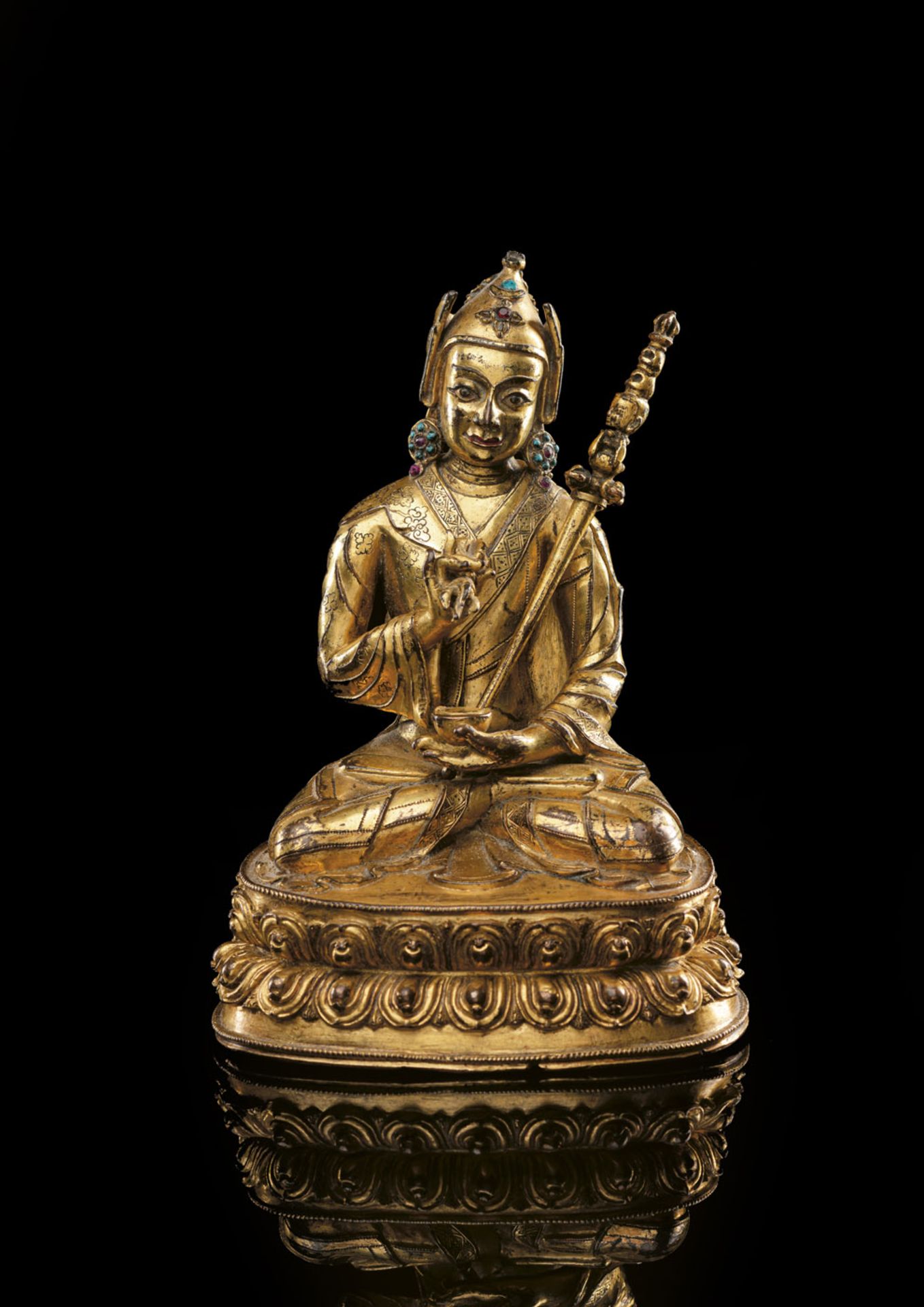 A VERY FINE GILT-BRONZE FIGURE OF PADMASAMBHAVA