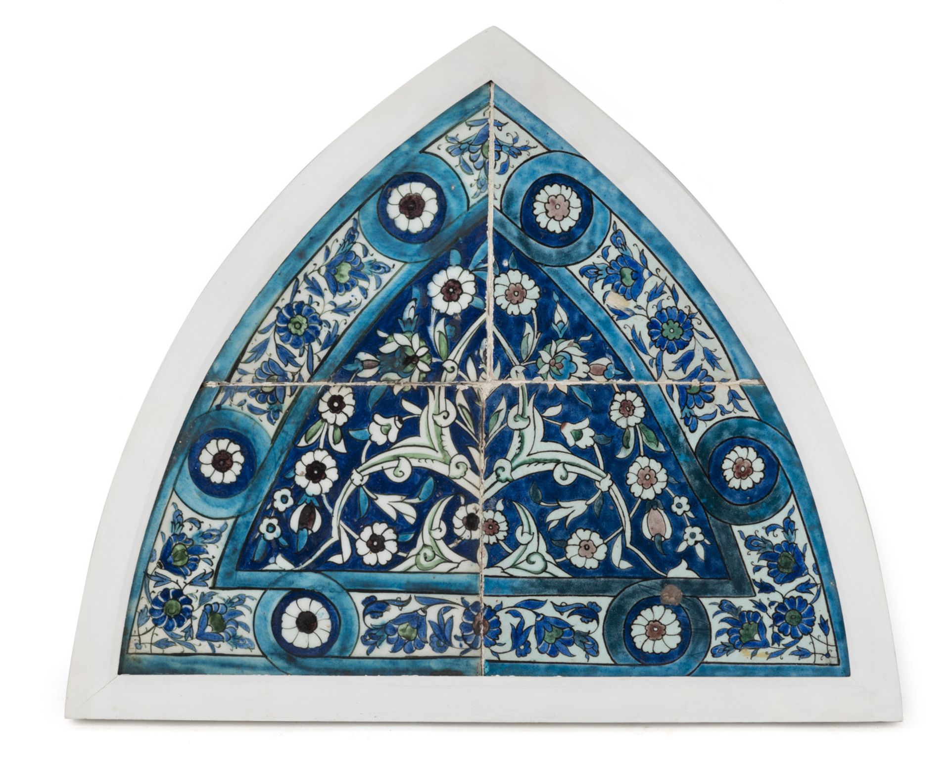 FOUR POLYCHROME GLAZED  POTTERY TILES OF AN ARCH