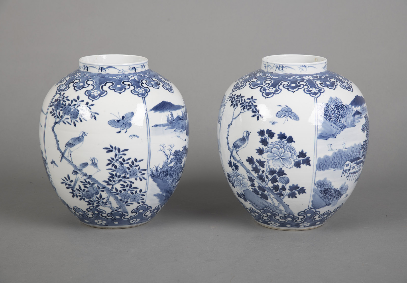 A PAIR OF BLUE AND WHITE LANDSCAPE AND FLORAL PORCELAIN VASES - Image 2 of 4