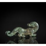 A GREEN PATINATED BRONZE FITTING IN SHAPE OF A DRAGON
