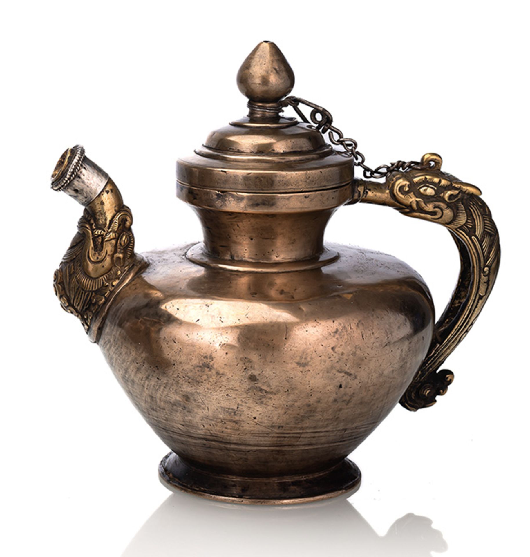 A METAL AND SILVER TEAPOT