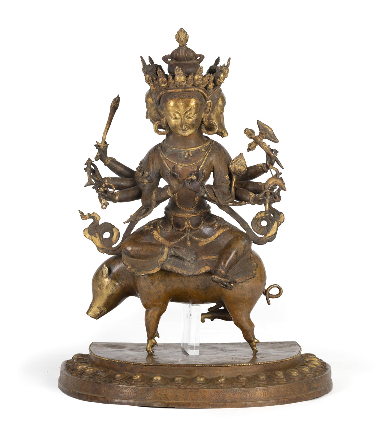 A LARGE BRONZE FIGURE OF A BUDDHIST DEITY SEATED ON A PIG