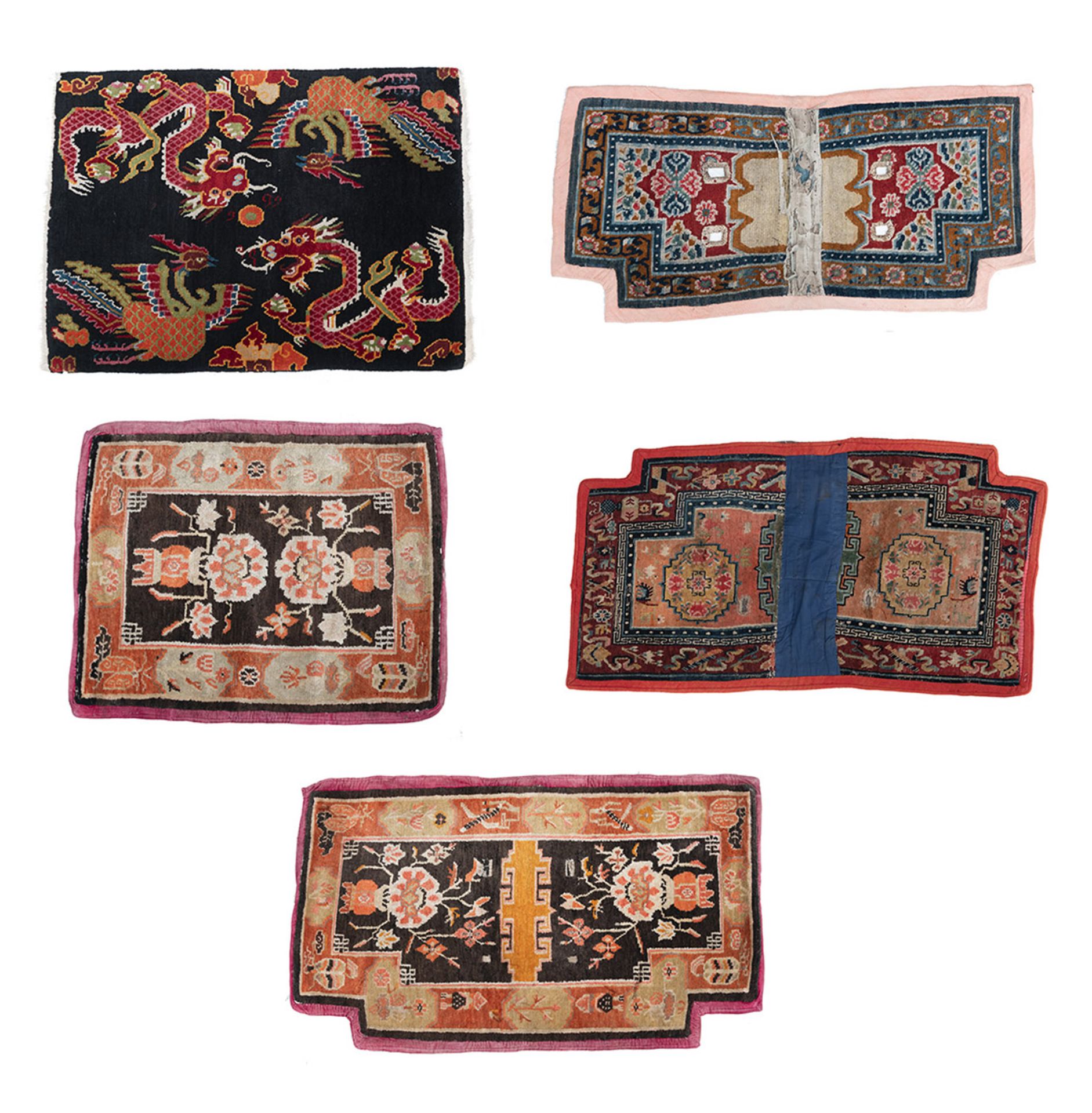 THREE SADDLE COVERS AND TWO SEAT MATS WITH VARIOUS MOTIFS