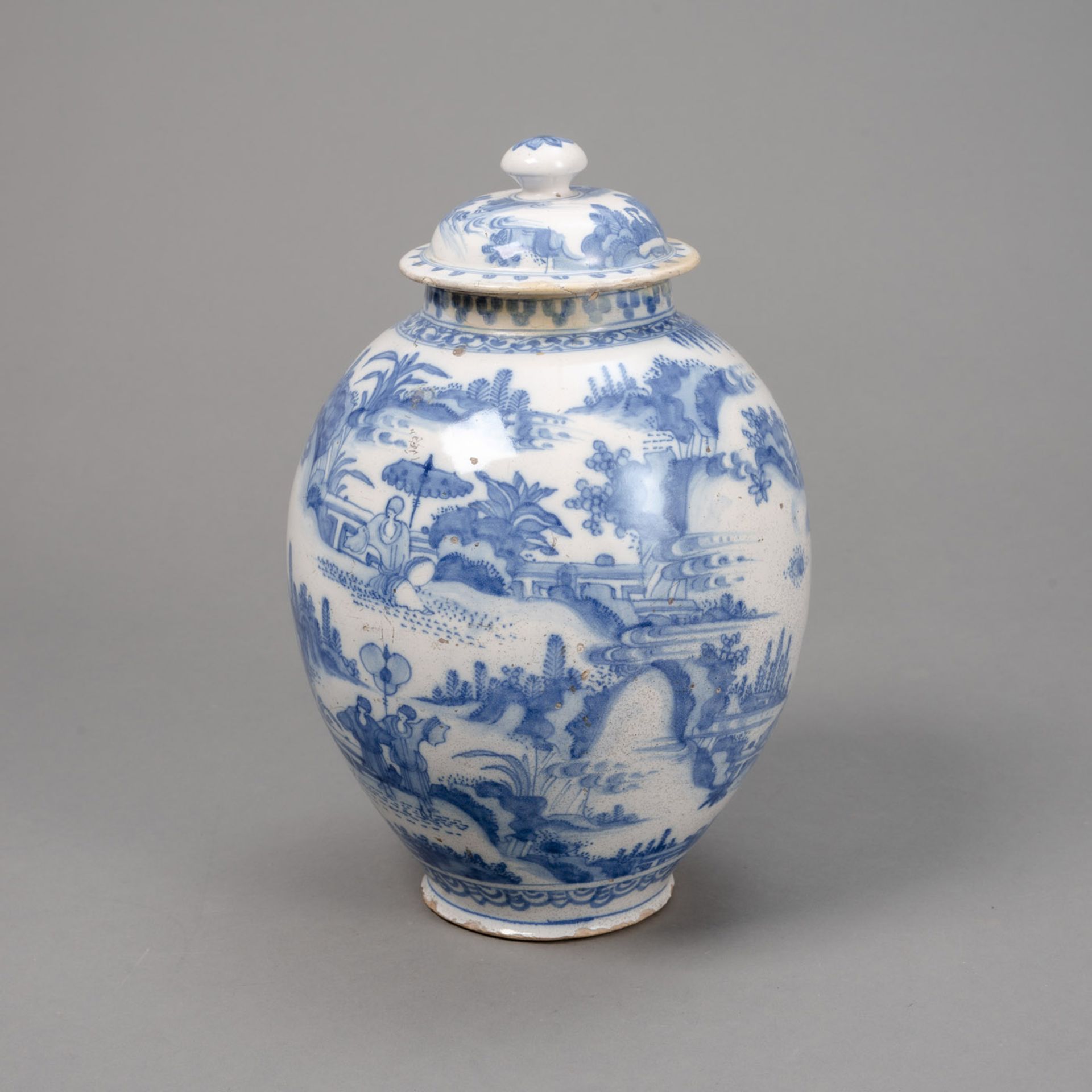 A BLUE AND WHITE LANDSCAPE VASE AND COVER