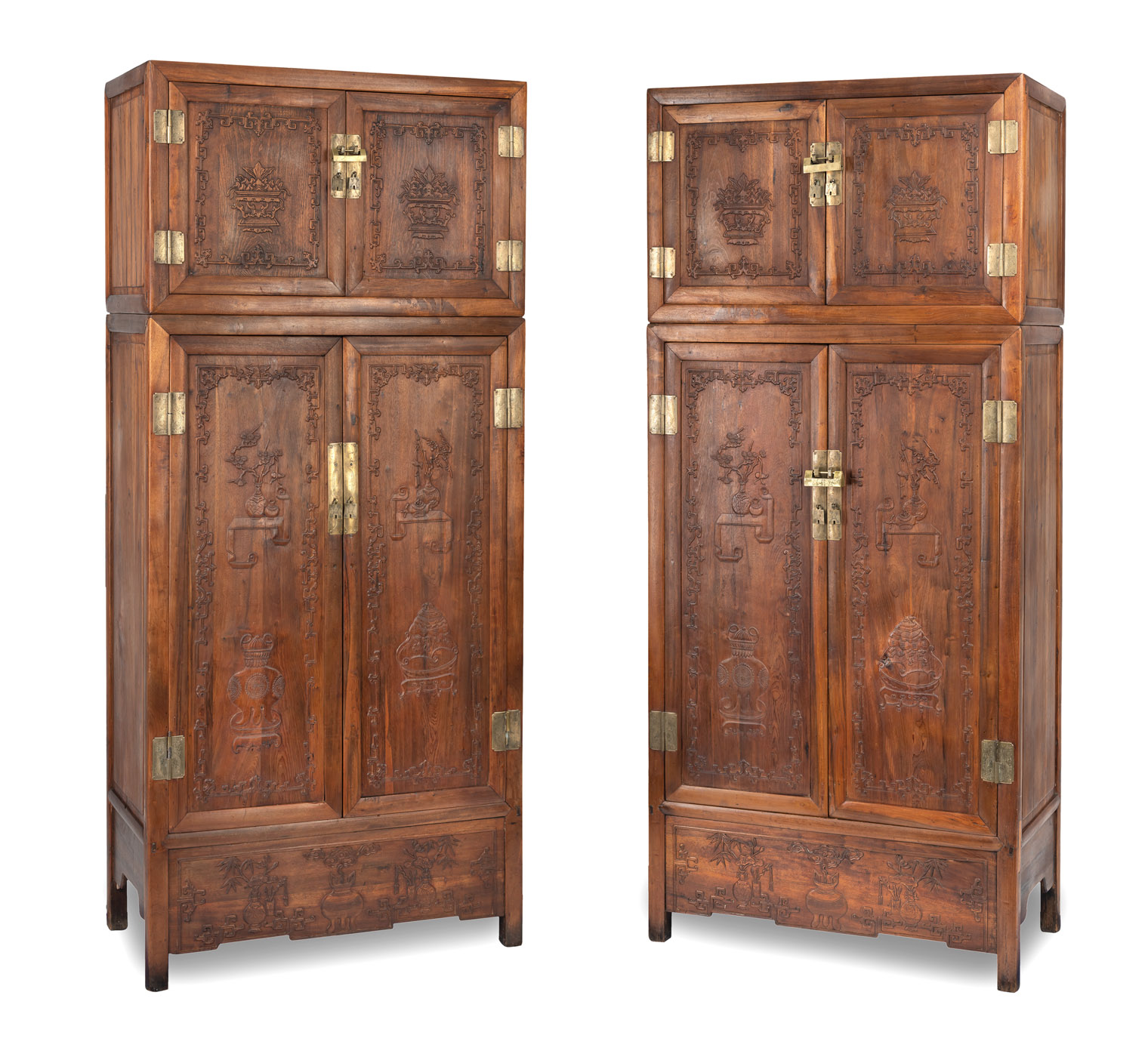 ERRATUM: A PAIR OF BROWN WOOD COMPOUND CABINETS WITH ANTIQUITIES IN LOW RELIEF