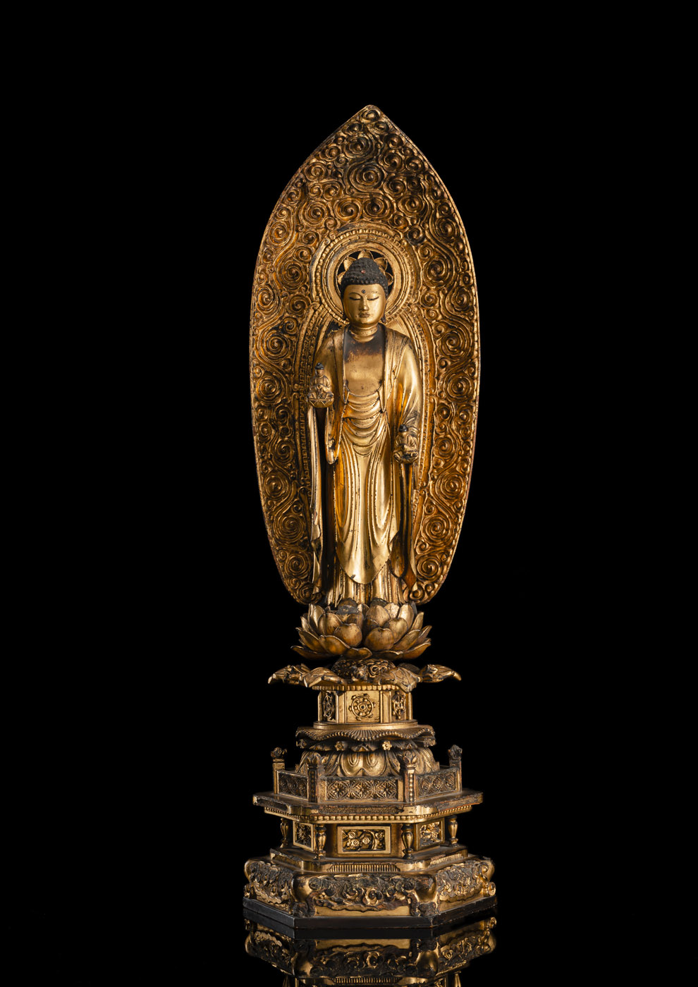 A GILT- AND BLACK-LACQUERED WOOD FIGURE OF AMIDA NYORAI