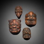 Vier Masken-Netsuke aus Holz