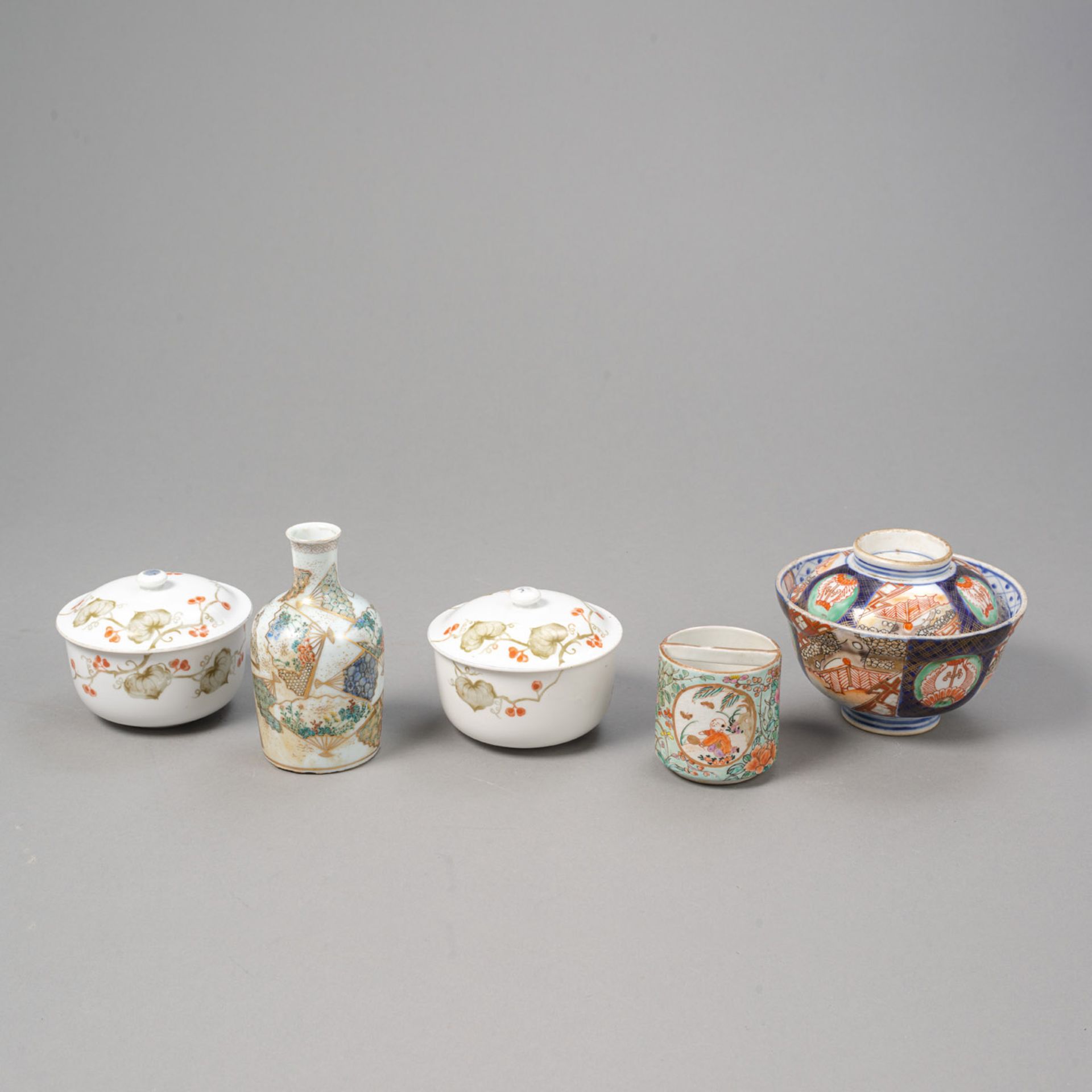 AN IMARI-PORCELAIN LIDDED BOWL, A SMALL SAKE BOTTLE, AND TWO BOXES AND COVERS