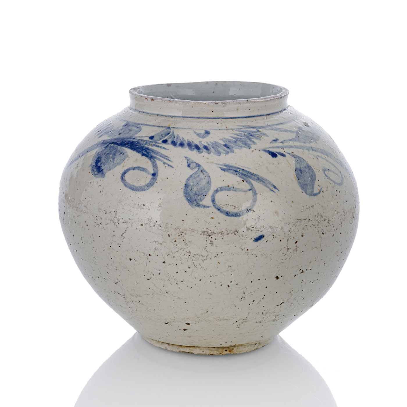 A BLUE AND WHITE JAR WITH BLOSSOMS AND SCROLLWORK