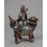 Champlevé-Figur des Kannon auf einem Shishi