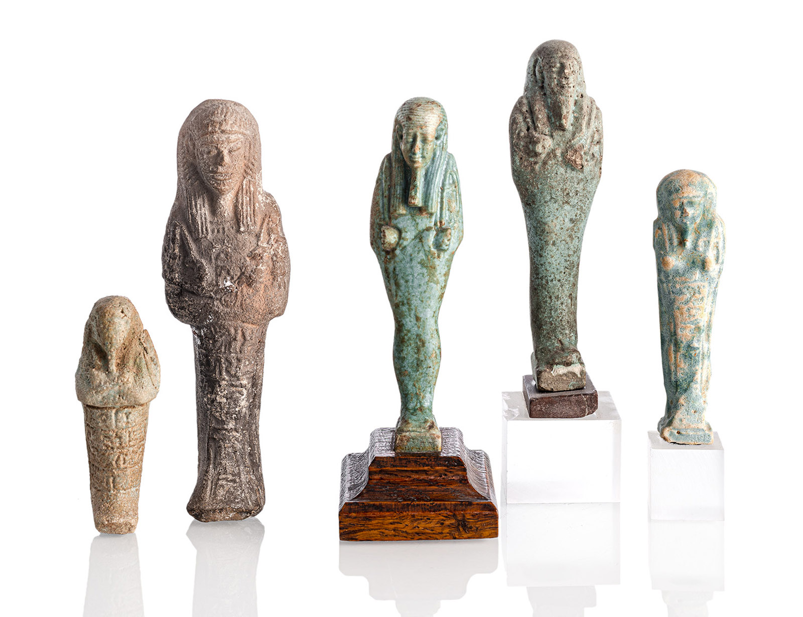 A GROUP OF FIVE TERRACOTTA USHABTI FIGURES