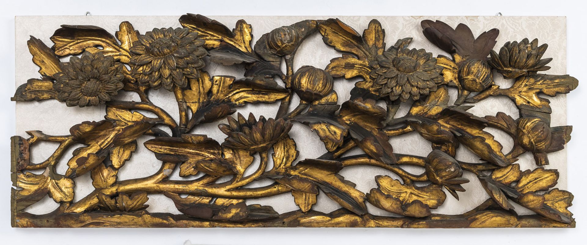 A GILT-LACQUERED WOOD PANEL WITH CHRYSANTHMUMS AND BLOSSOMS