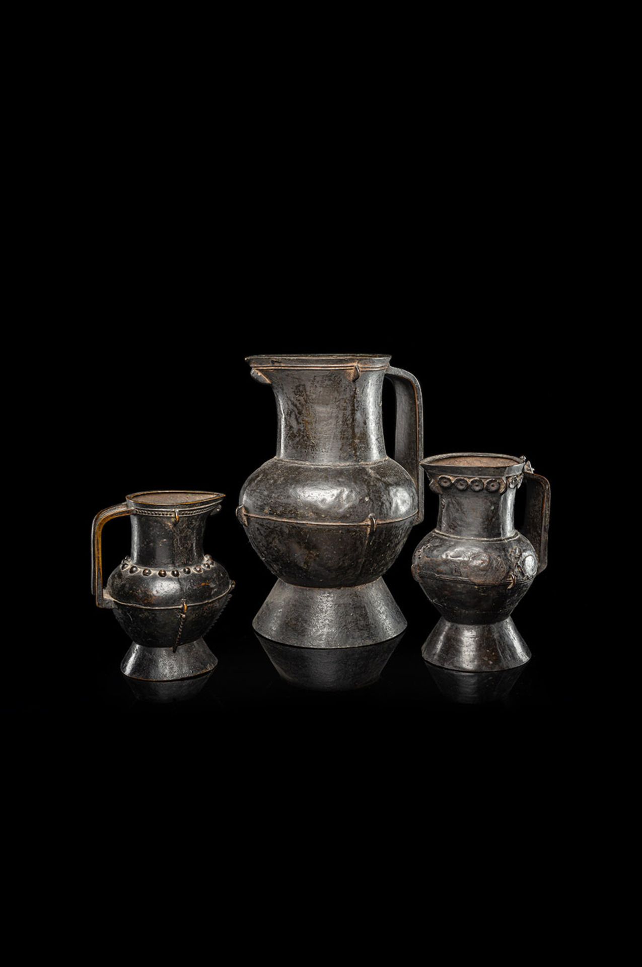 THREE BRONZE EWERS