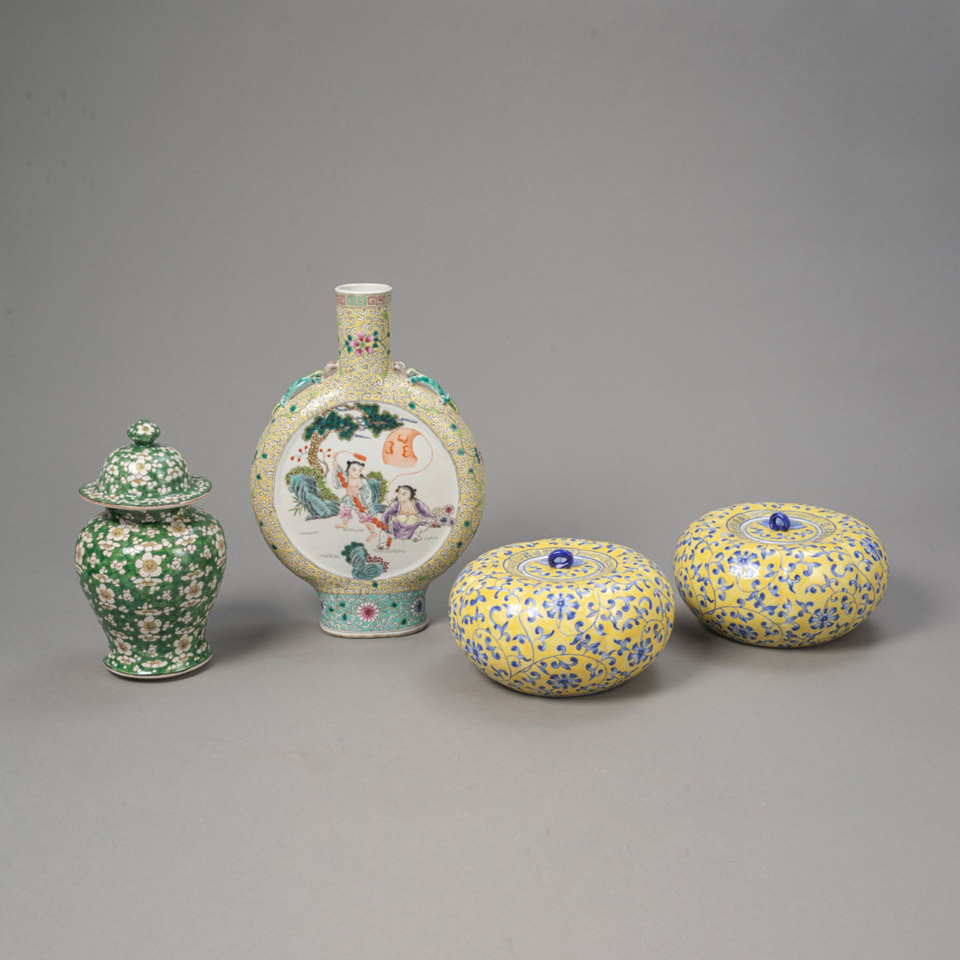 LOT OF PORCELAIN: TWO YELLOW-GROUND GOURD-SHAPED COVERED VESSELS, A PILGRIM BOTTLE, A GREEN-GROUND