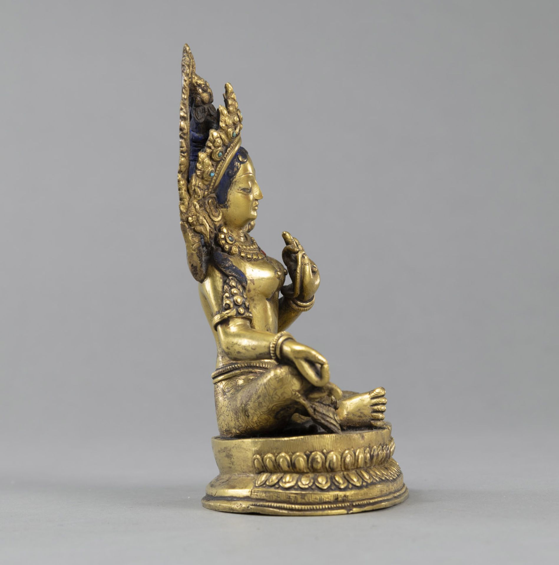 A SEATED GILT BRONZE SEATED TARA WITH STONE INLAY - Image 2 of 4