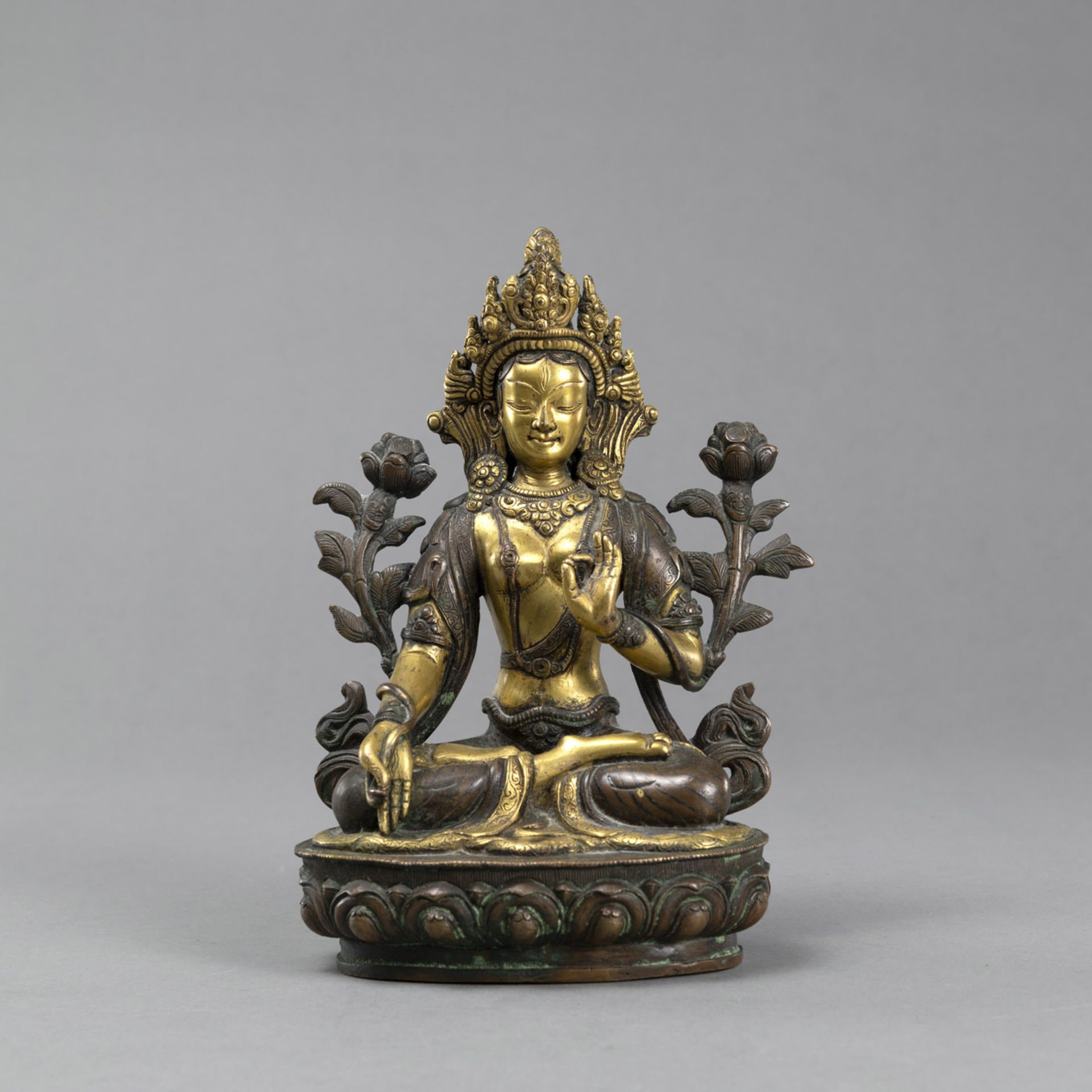 A SEATED COPPER BRONZE WHITE TARA, PARTIALLY GILT AND ENGRAVED