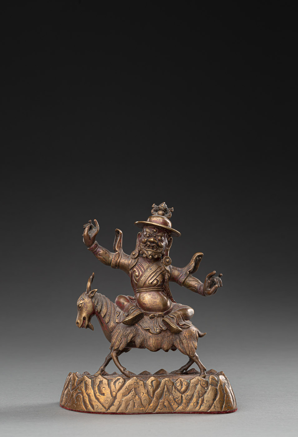 A BRONZE FIGURE OF A LOCAL DEITY