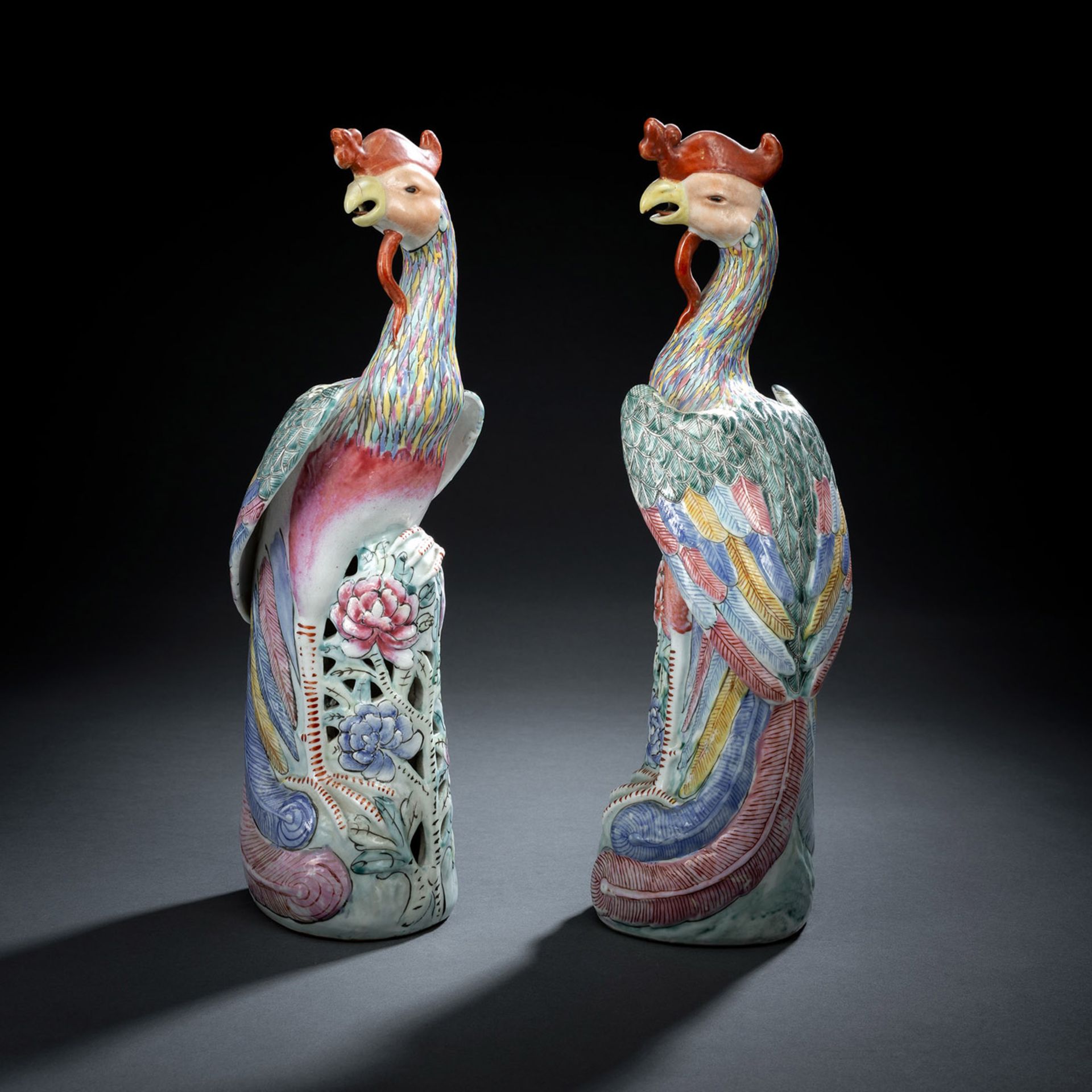 A PAIR OF POLYCHROME PAINTED PORCELAIN PHIOENIXES BY JIN YUNYAN (1904-1986)