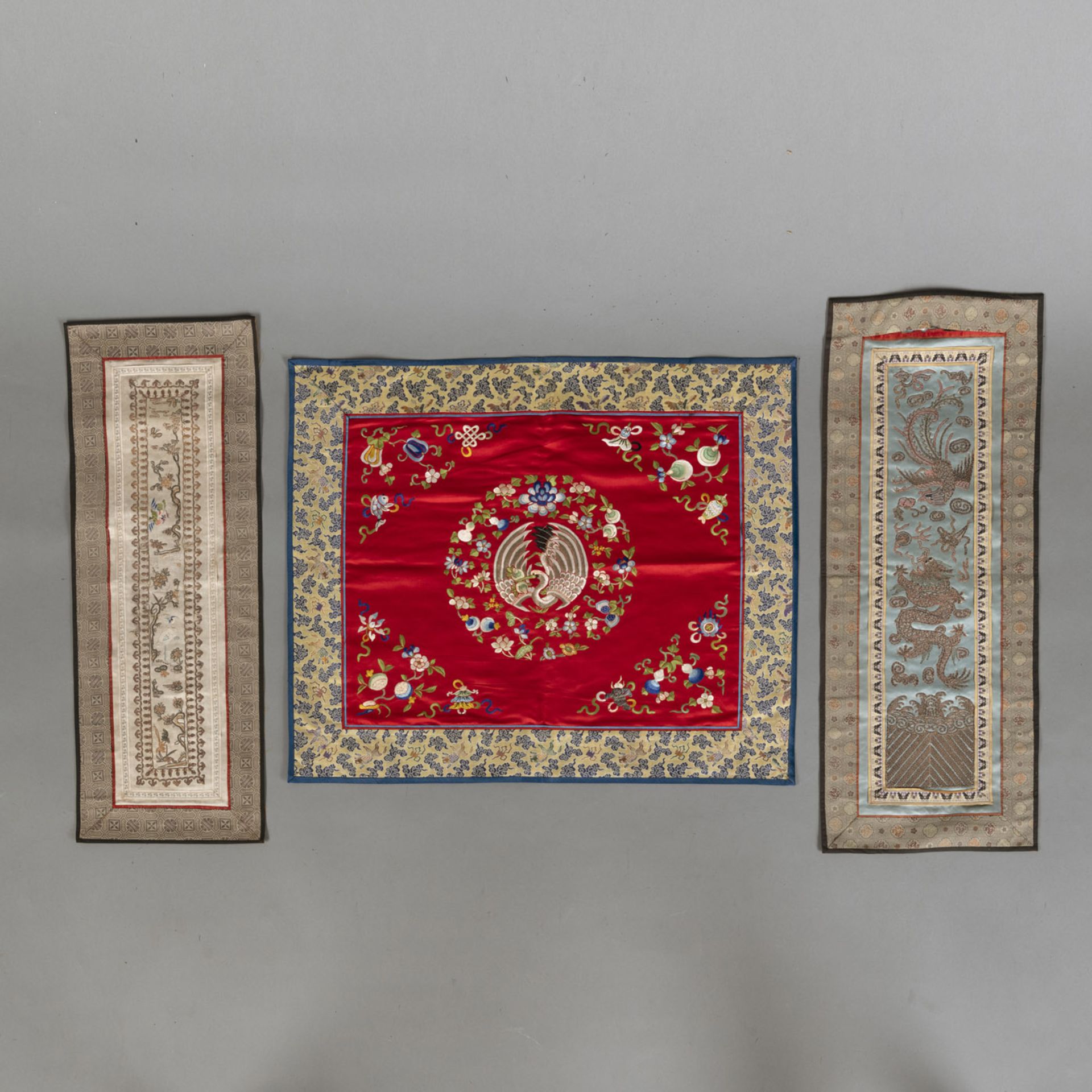 EIGHT SILK EMBROIDERIES DEPICTING DRAGONS AND OTHER ANIMALS AND FIGURES