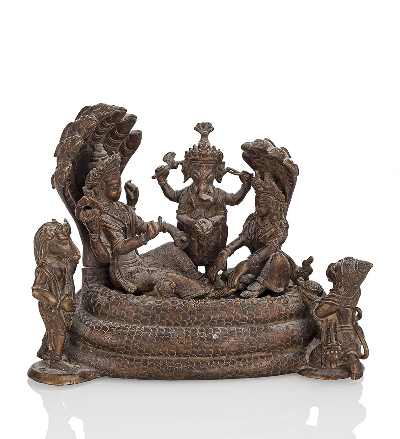 A BRONZE GROUP OF FIVE DEITIES ATOP A SNAKE