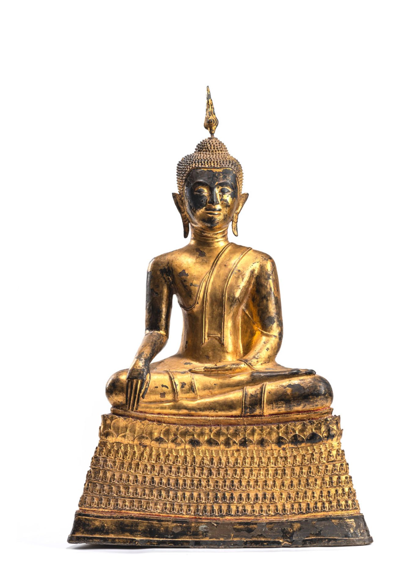 A GILT- AND RED-LACQUERED BRONZE FIGURE OF BUDDHA SHAKYAMUNI