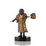 A SUPERB AND RARE GOLD INLAID IRON AND BRONZE FIGURE OF A STANDING MAN WITH A QUIVER