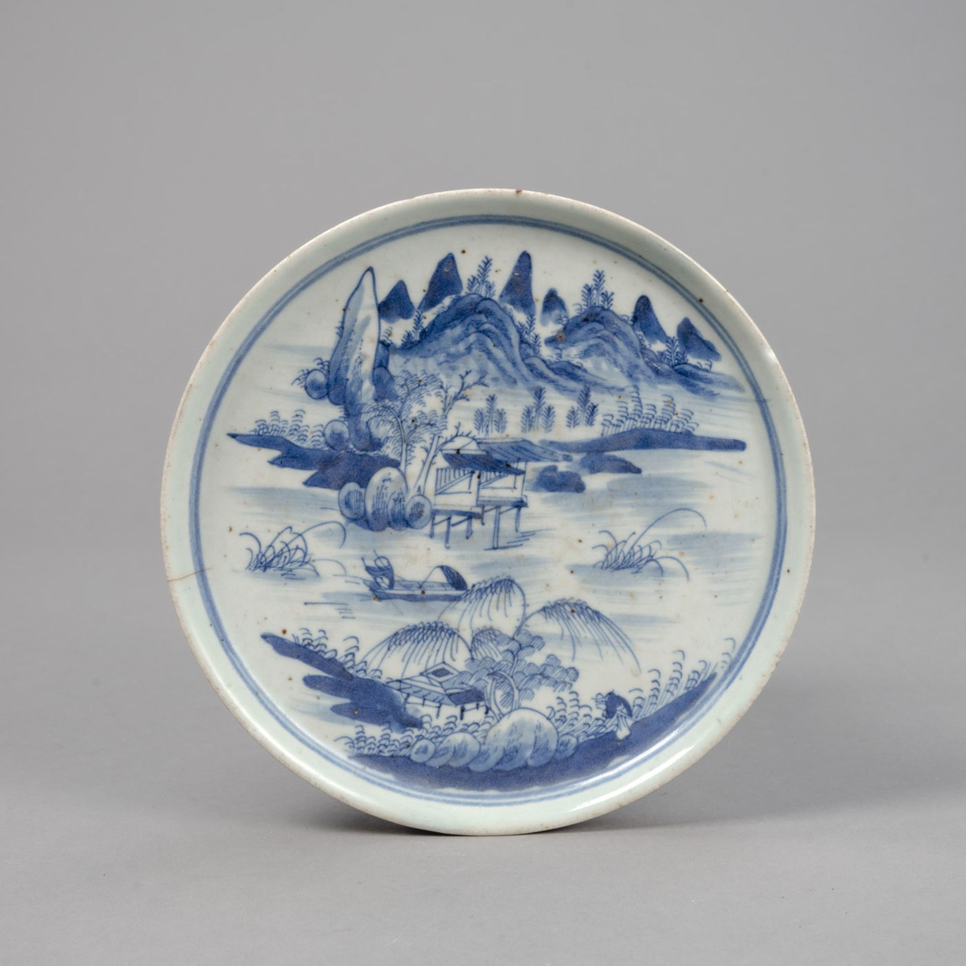 A BLUE AND WHITE LANDSCAPE PORCELAIN DISH