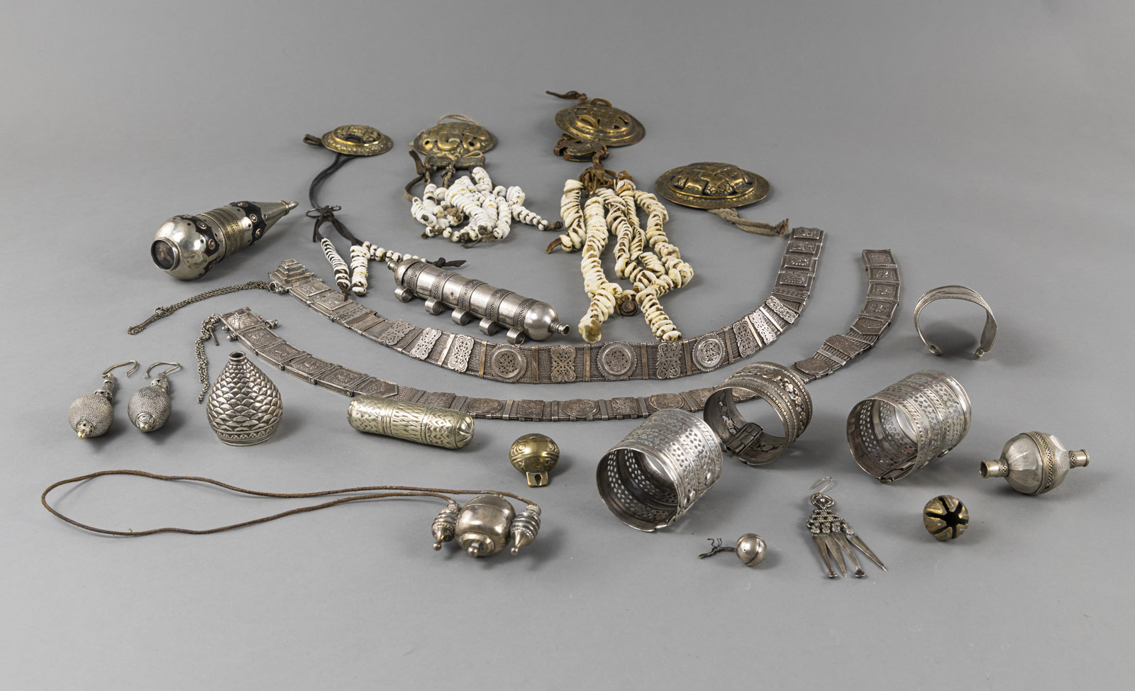 A GROUP OF 22 PIECES OF JEWELRY, PARTLY SILVER: BELTS, BRACELETS, AMULETS AND MEDALLION CHAINS - Image 2 of 3