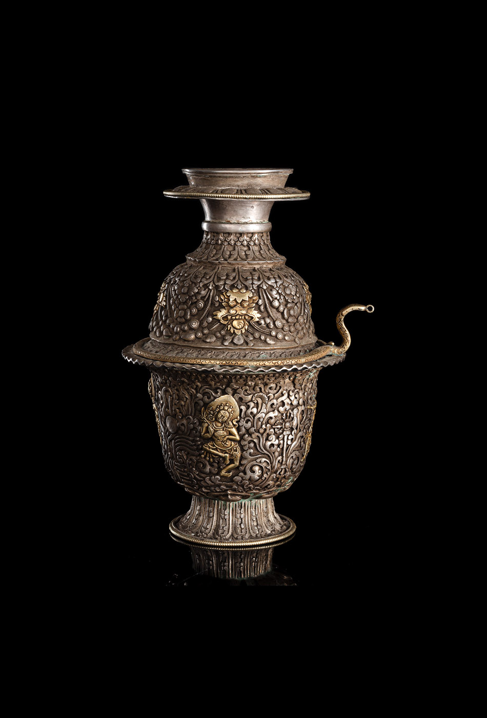 AN EMBOSSED PARCEL-GILT SILVER RELIC CONTAINER