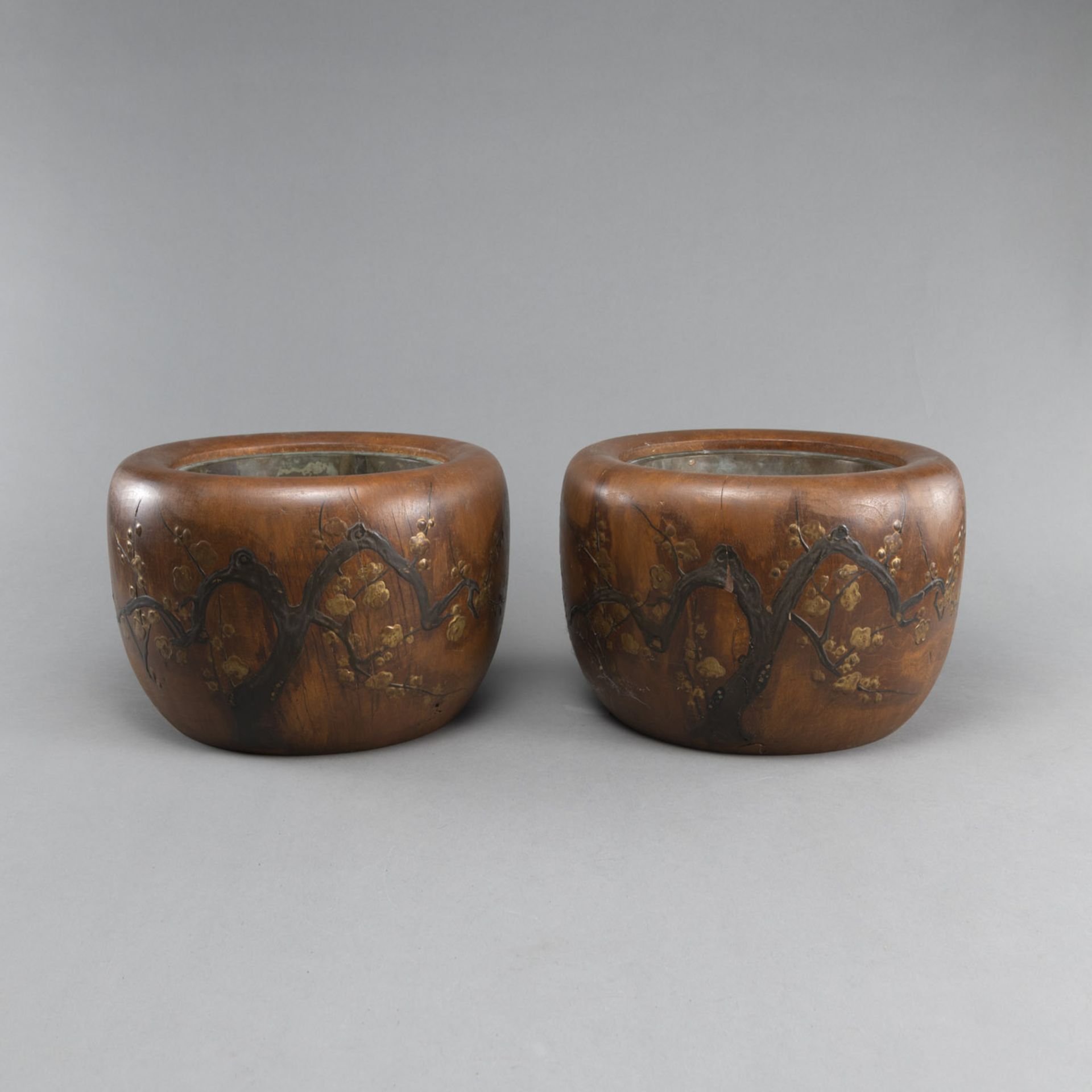 A PAIR OF WOOD CACHEPOTS WITH LACQUER DECORATION OF PRUNUS BRANCHES