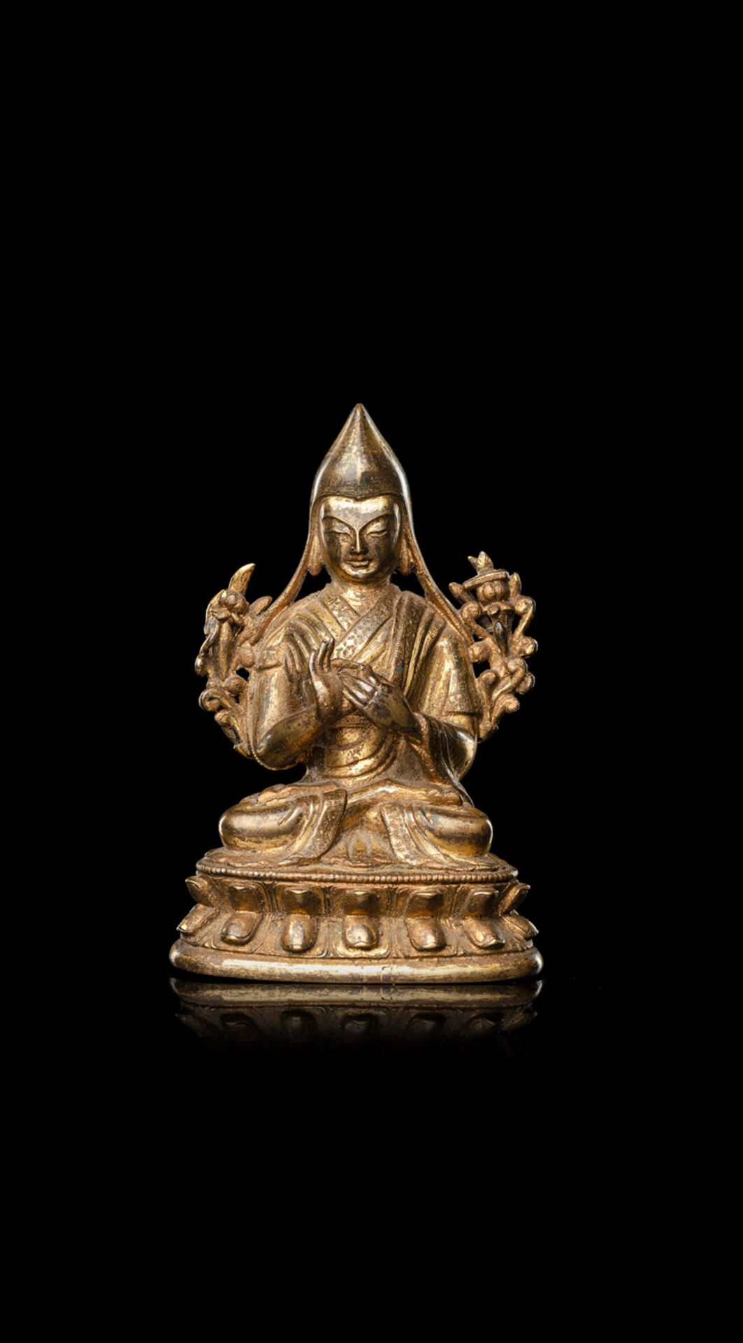 A GILT-BRONZE FIGURE OF TSONGKHAPA