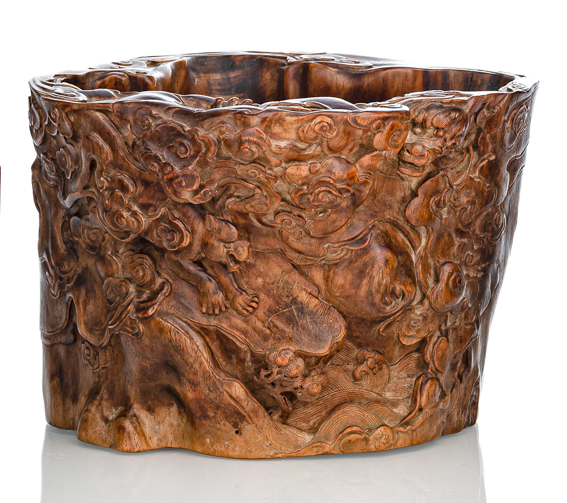 A FINE CARVED HUANGHUALI DRAON AND TIGER BRUSHPOT WITH CLOUDS AND ROCKS