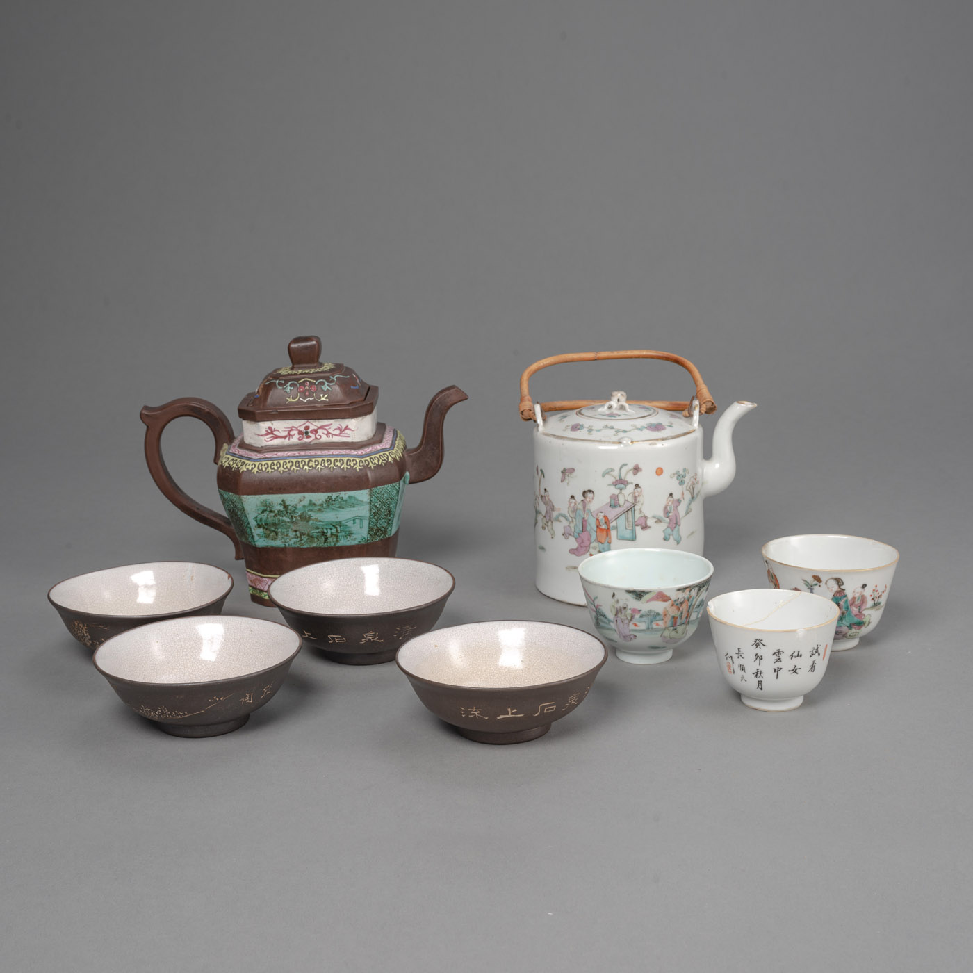 A 'FAMILLE ROSE' PORCELAIN EWER AND THREE CUPS WITH A SET OF YIXING TEAPOT AND FOUR BOWLS