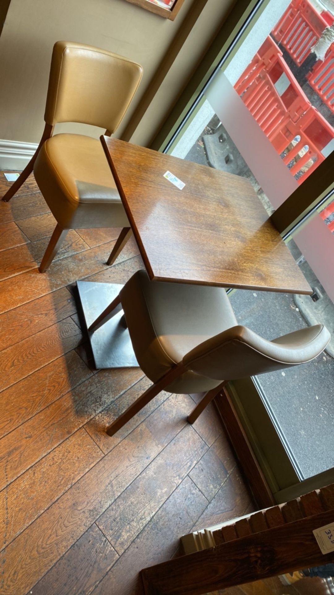 Square wooden table with two leather effect chairs