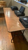 Wooden table with black metallic frame