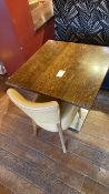 Square wooden table with steel base and one leathe