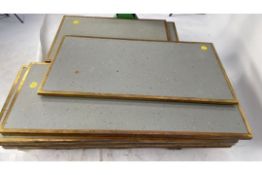 Grey tabletops with brass edging