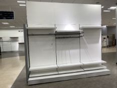 Large partition wall with shelving