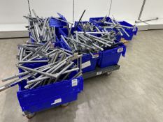 A number of boxes containing metal wall hangers and shop fittings