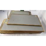 Grey tabletops with brass edging