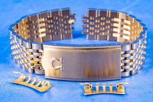 Gliederarmband mit Faltschließe, Omega, Stahl vergoldet, Länge ca. 25 cm, wohl ungetragen.