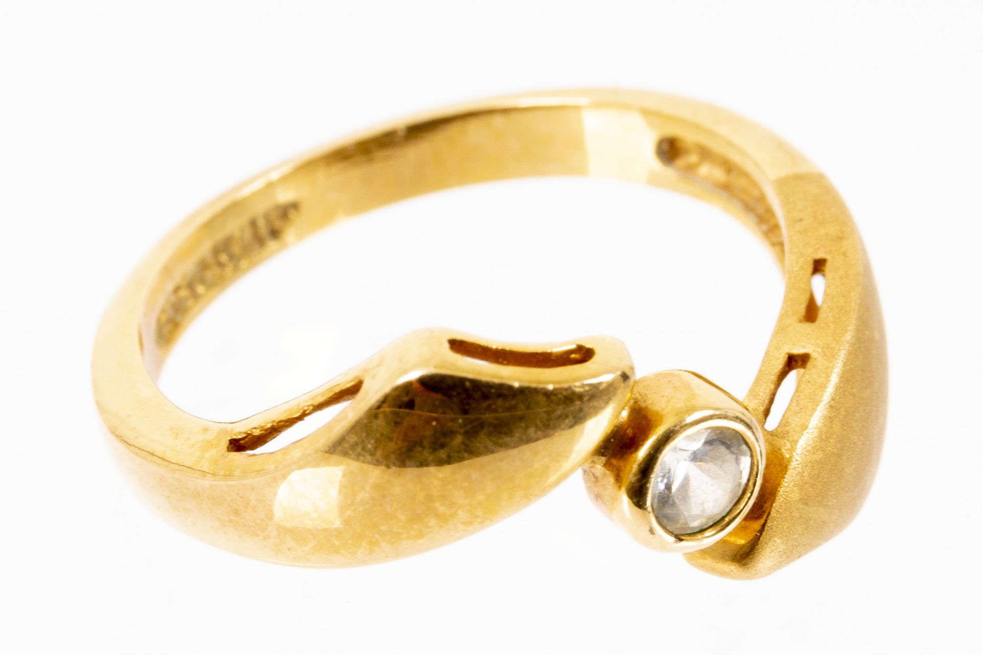 18 K Gelbgold-Ring mit Zirkonia-Besatz, Innendurchmesser ca. 18 mm, ca. 3,5 gr. brutto.